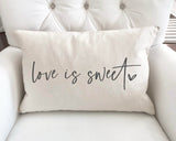 Actual previously made Love Is Sweet lumbar cover, shown only as a fabric and print-quality example; design not included.