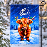 All is Bright Highland cow garden flag on a black stand in a snowy winter setting; stand not included
