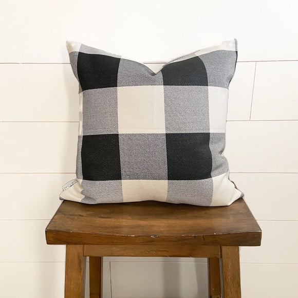 Black & White Large Buffalo Plaid Pillow Cover 18 by 18 inches displayed on stool 