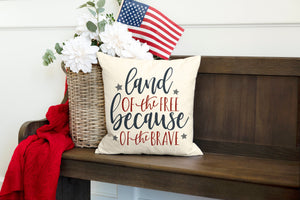 Land of the free because of the brave pillow cover displayed on a bench