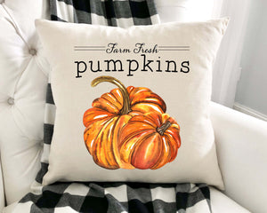 Orange painted pumpkins pillow cover displayed on chair 18 by 18 inches 