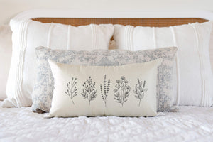 Floral Sprigs Spring Decorative Pillow Cover displayed on bed