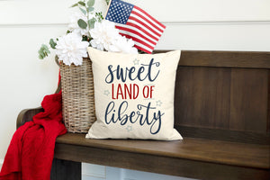 Sweet Land of Liberty 4th of July decorative pillow cover on bench