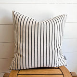 The Claire Woven pillow cover displayed on stool 18 by 18 inches 